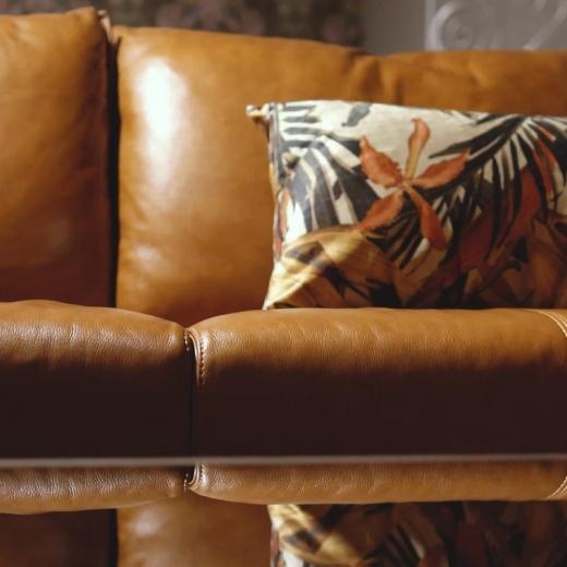 Warm amber tones, supple leather, timeless design. A statement piece that brings quiet luxury to mode...
