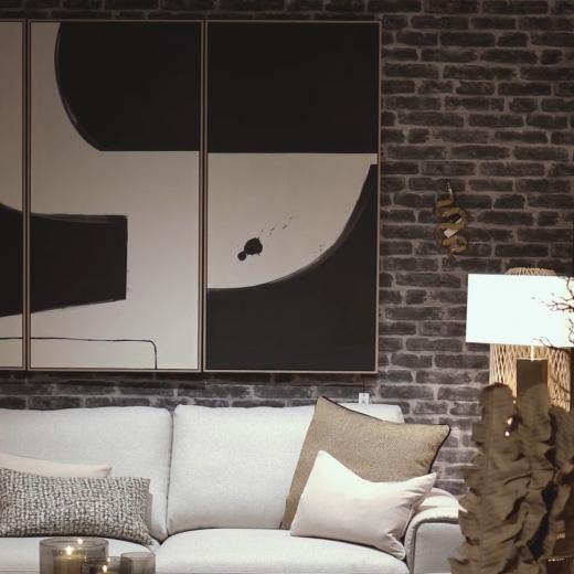 Soft neutrals meet bold contrast. A timeless cream sofa paired with monochrome art - proof that simpl...