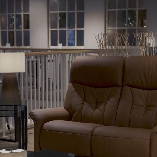 Comfort, shared. A tan leather recliner designed for two, easy, inviting and made for everyday moment...