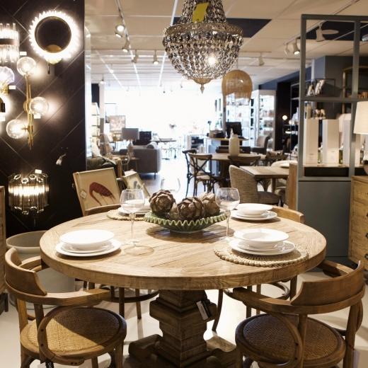 Crafted from natural oak and paired with woven seat chairs for a timeless, understated look.